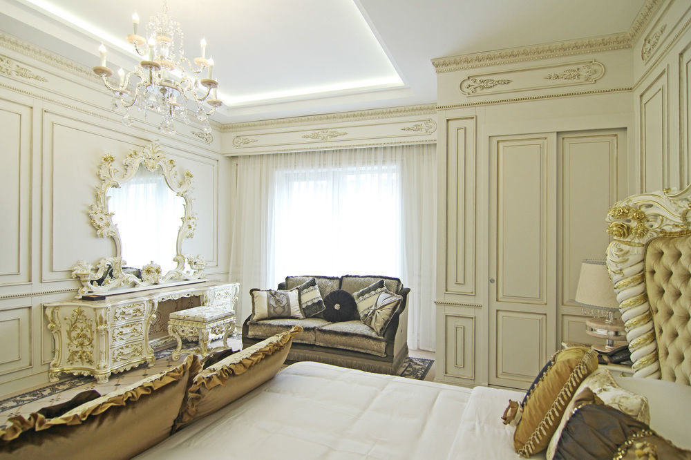 فندق أوريون بيشكيك المظهر الخارجي الصورة A bedroom